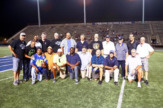 Members of the 1983 Pony Bowl championship team meet at halftime for a 30-year reunion