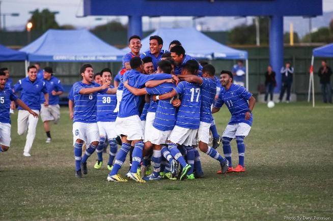 Cerritos men's soccer team celebrates after their 2-1 win over Santiago Canyon on penalty kicks