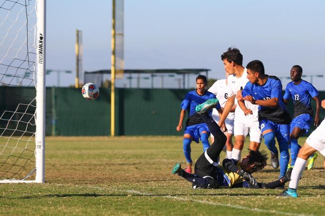 Oscar Canela (18) watches one of his two goals go into the net in the Falcons win