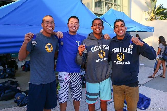 The quartet of (L-R) Joshua Owens. Jason Ly, Angel Rojas and Marlon Moreno show off their championship medals from the 200-yard medley relay