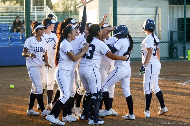 Kimberly Olivas (9) is celebrated after drawing game-winning walk