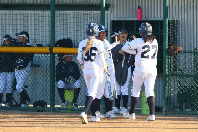 File Photo: Teammates greet Briana Lopez (27), who homered and drove in three runs against Compton