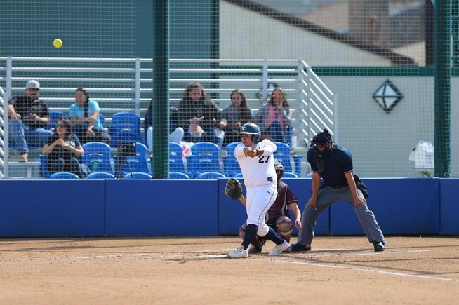 Briana Lopez launches the first of her two home runs against Compton