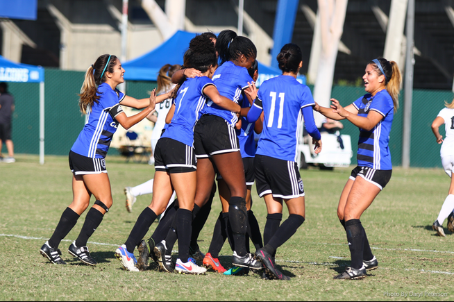 The Cerritos women's soccer team celebrates a goal in their 6-3 win
