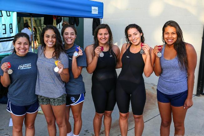 Several Cerritos swimmers show off their medals at the SCC Championships