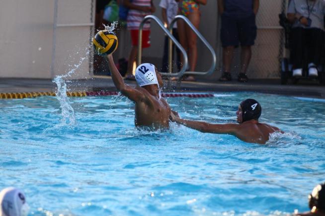Miguel Garcia (12) scores one of his team-high five goals in a 14-13 shootout loss to Long Beach City.