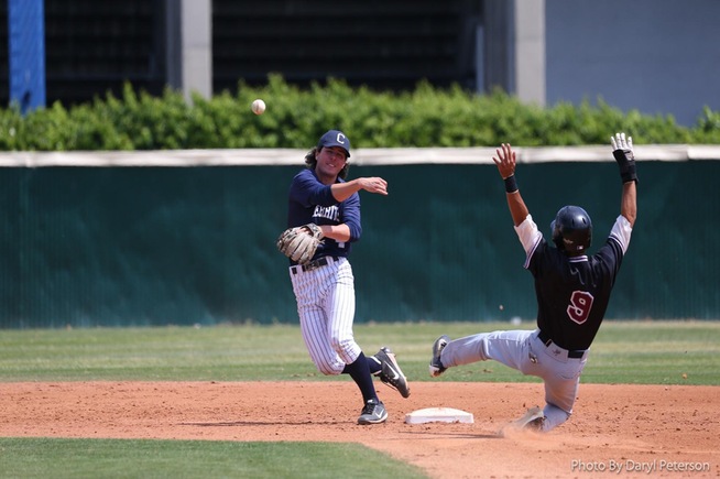 Second baseman Trevor McInerney turns a double play against Compton