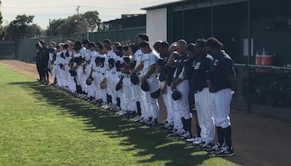 The Falcons baseball teams observes a moment of silence in honor of the Altobelli family before their game against LA Valley