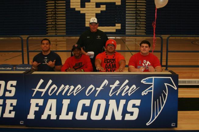 (L-R) Dominic Tiapula, Theodore Chambers, Kyle Peko and Sean Rubalcava are joined by Falcon head coach Frank Mazzotta, as they all sign their letters of intent.