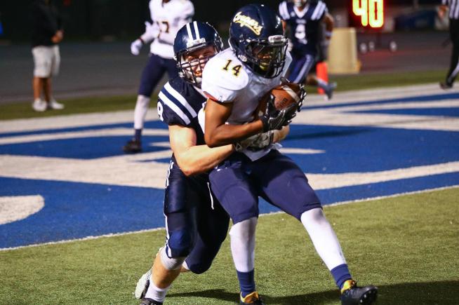 Alex Bush (9) makes the game-saving tackle in the Falcons win over Canyons