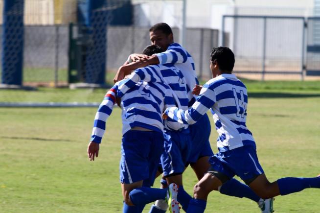 Carlos Torres (2) is congratulated by teammates after his early goal gave the Falcons a 1-0 lead.