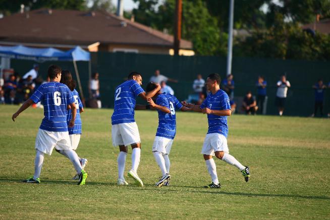 Andy Ramirez (9) is greeted by teammates after scoring the eventual game-winning goal against Oxnard