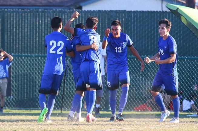 The Falcons celebrate after Christian Perez (13) scored the game-winning goal