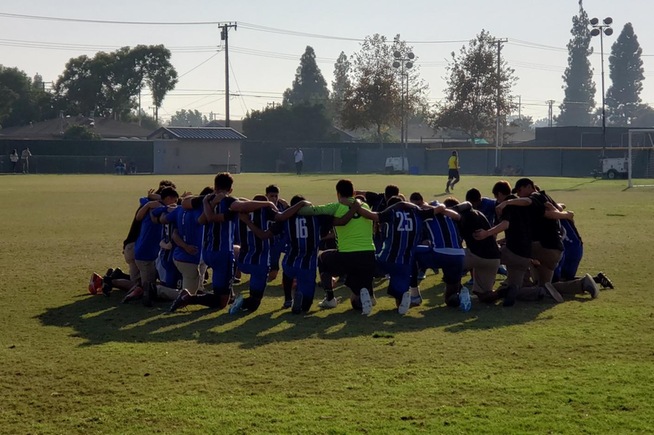 Cerritos men's soccer team gathers together before their game