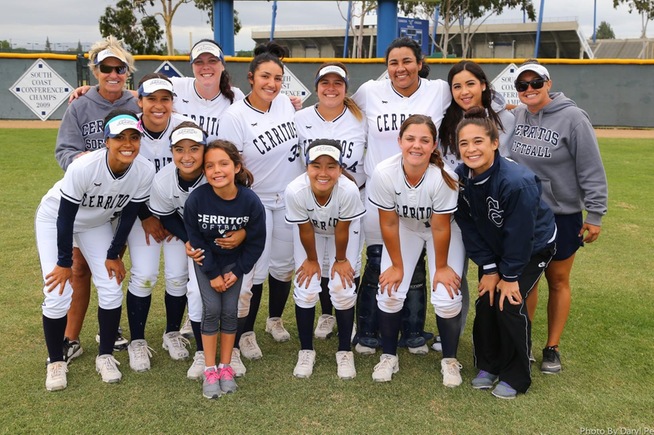 The Cerritos softball team celebrates head coach Kodee Murray winning her 500th game and advancing to the Super Regional