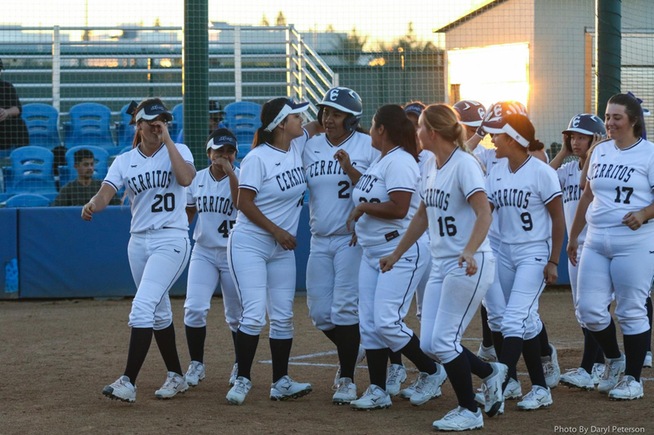 Teammates congratulate Briana Lopez (27) after her sixth-inning grand slam