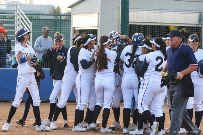 Falcons celebrate after Brianna Spoolstra's game-ending grand slam