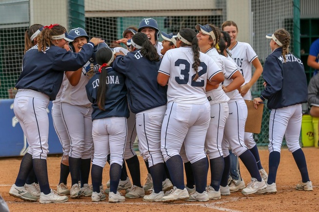 Itzel Soto is mobbed by teammates after her walk-off home run