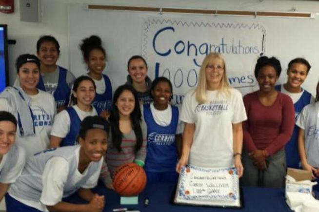 Cerritos women's basketball coach Karen Welliver is joined by her team to celebrate her 1000th game as head coach