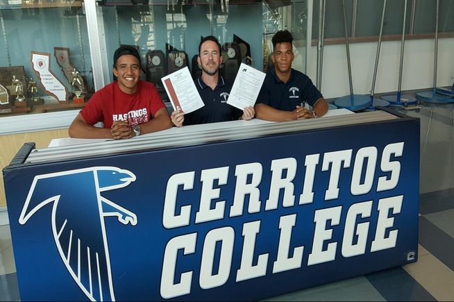 Head coach Donny Garriott (center) is flanked by Richard Pocock and Kevin James, who signed National Letters of Intent