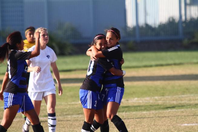 Claudia Lopez (10) and Lauren Nanez (7) celebrate the Falcons second goal in a 2-0 playoff win over Cypress.