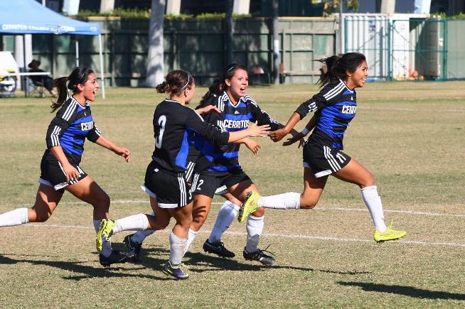 Jazmin Aguas is pursued by her teammates after scoring the winning goal in the final minute against Cypress