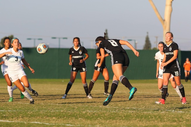Elizabeth Mendez heads home the Falcons first goal in a 2-0 win