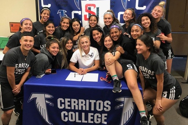Sydney Carr is joined by her teammates as she signs with Seattle University