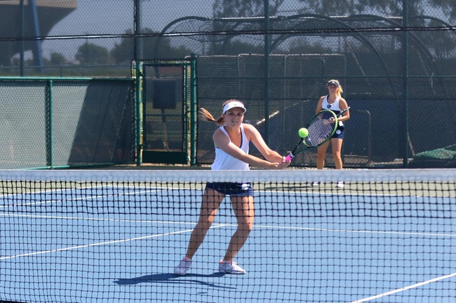 Petra Such returns a shot in her doubles match with teammate Moa Lindstrom