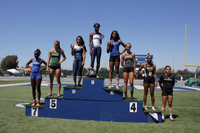 Alexus Dalton stands atop the podium after winning the Southern California Heptathlon Championship. Angel Sifuentes finished in third place.