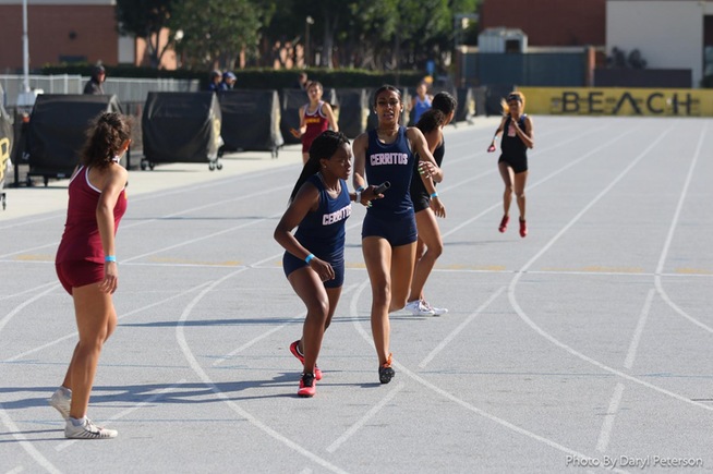 The Cerritos Women's Track & Field makes a handoff in the 4x400-meter relay
