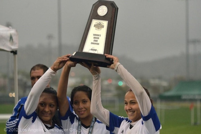 (L-R) Claudia Lopez, Claudia Ibarra and Lauren Nanez hold up the 2012 State Championship trophy