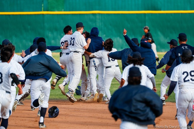 Falcons celebrate with Dean Ormonde, who drove in the game-winning run against Rio Hondo College