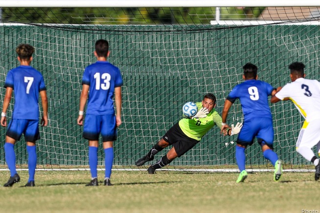 Luis Enciso makes a save on a penalty kick to help the Falcons win