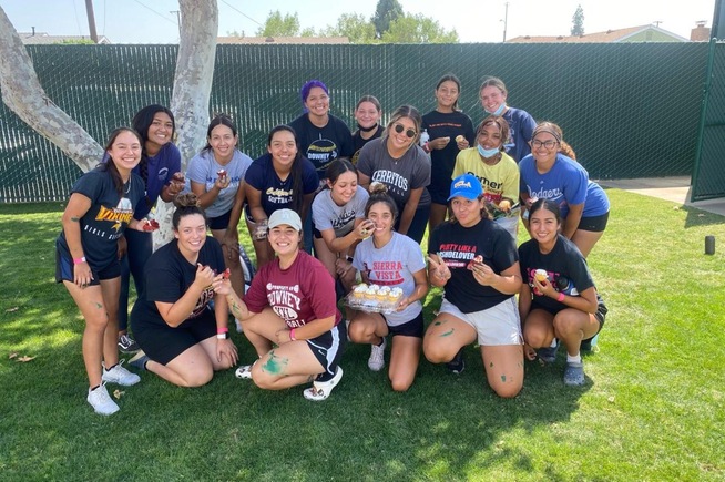 Cerritos College softball players put fresh coat of paint on parts of Nancy Kelly Field