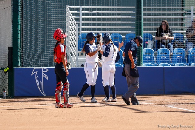 Brooklyn Bedolla (3) is greeted by teammates after her 2-run home run