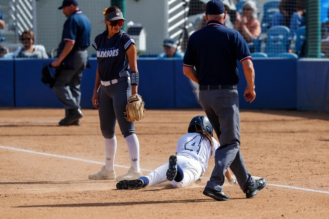Alyssa Capps slides into third base after her two-run triple in the Falcons 4-1 win