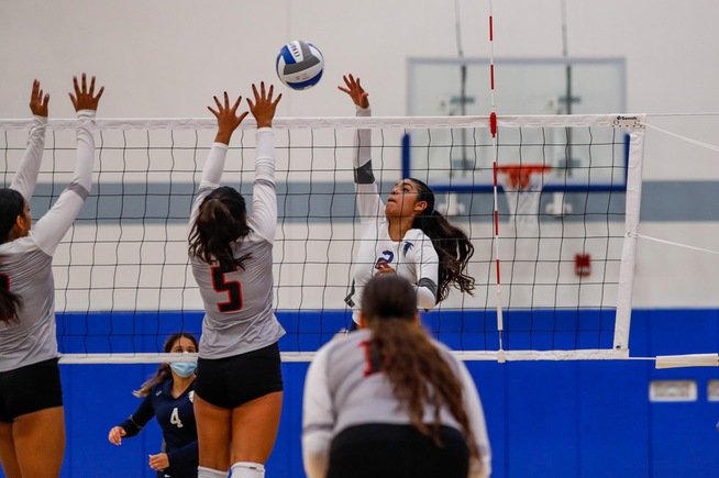 Marissa Mendibles posts one of her six kills for the Falcons in their win.